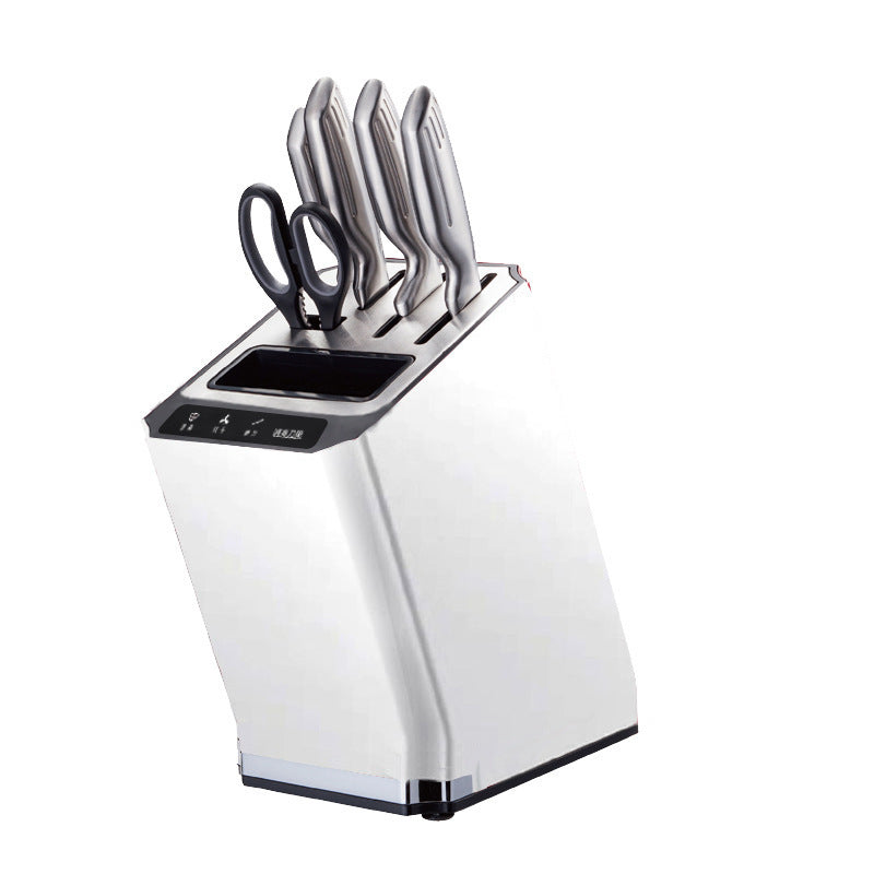 White compact smart knife holder sterilizer with slots for knives and scissors for hygienic kitchen organization.