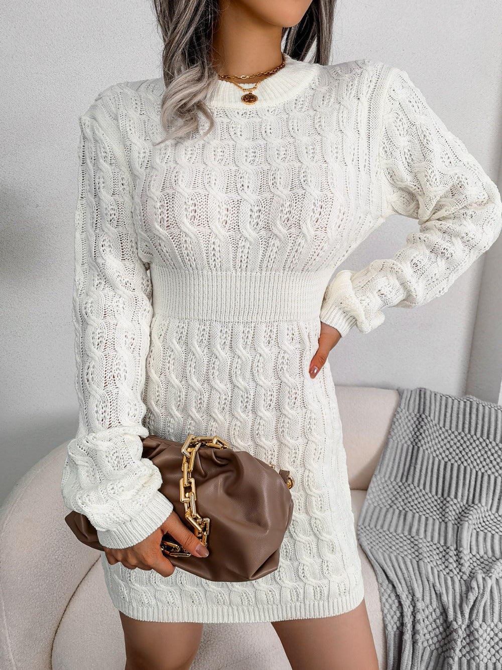 White cable knit sweater dress with a sculpting high waist design for winter daywear.