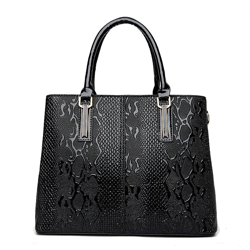 Black structured faux leather tote with textured animal print for daily carry.