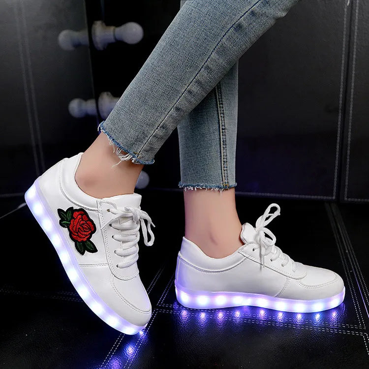 White sneakers with red rose embroidery and glowing LED soles for daily wear.