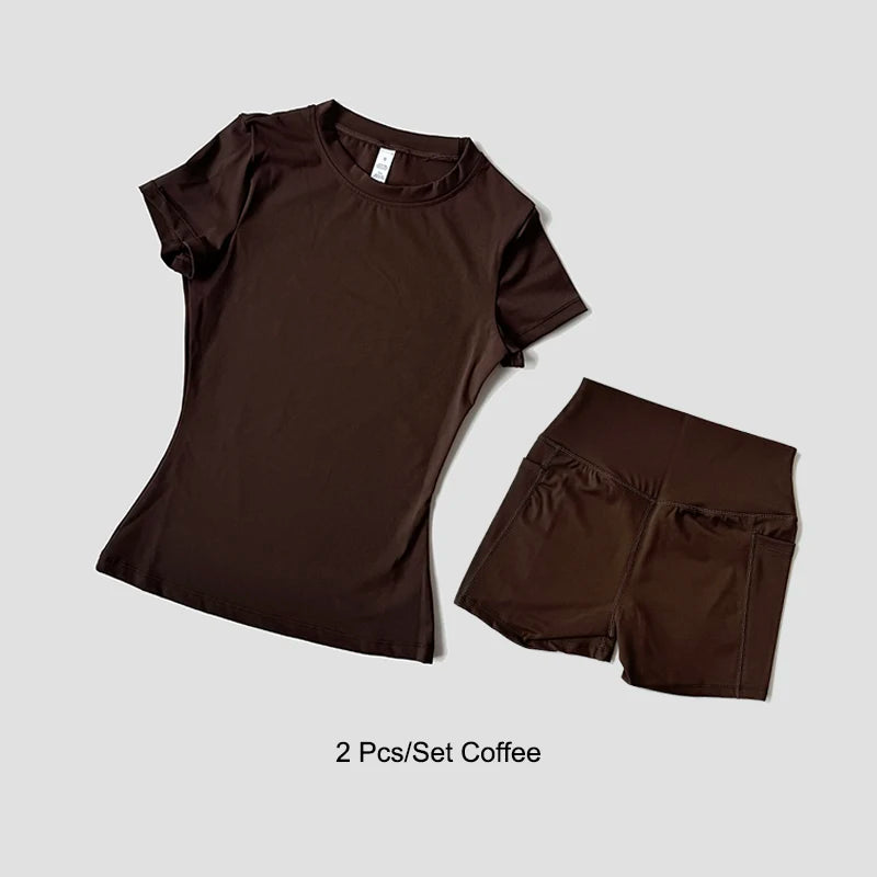 Dark brown sculpting yoga set with high waist shorts and short-sleeve fitted top for exercise.