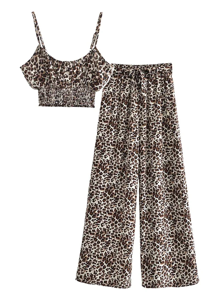 Brown animal print flowy two-piece set with a smocked crop top and high waist wide leg pants for beach vacations.