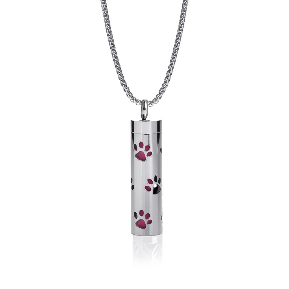Silver stainless steel cylinder locket with pink paw cutouts on a chain aromatherapy diffuser necklace for daily wear.