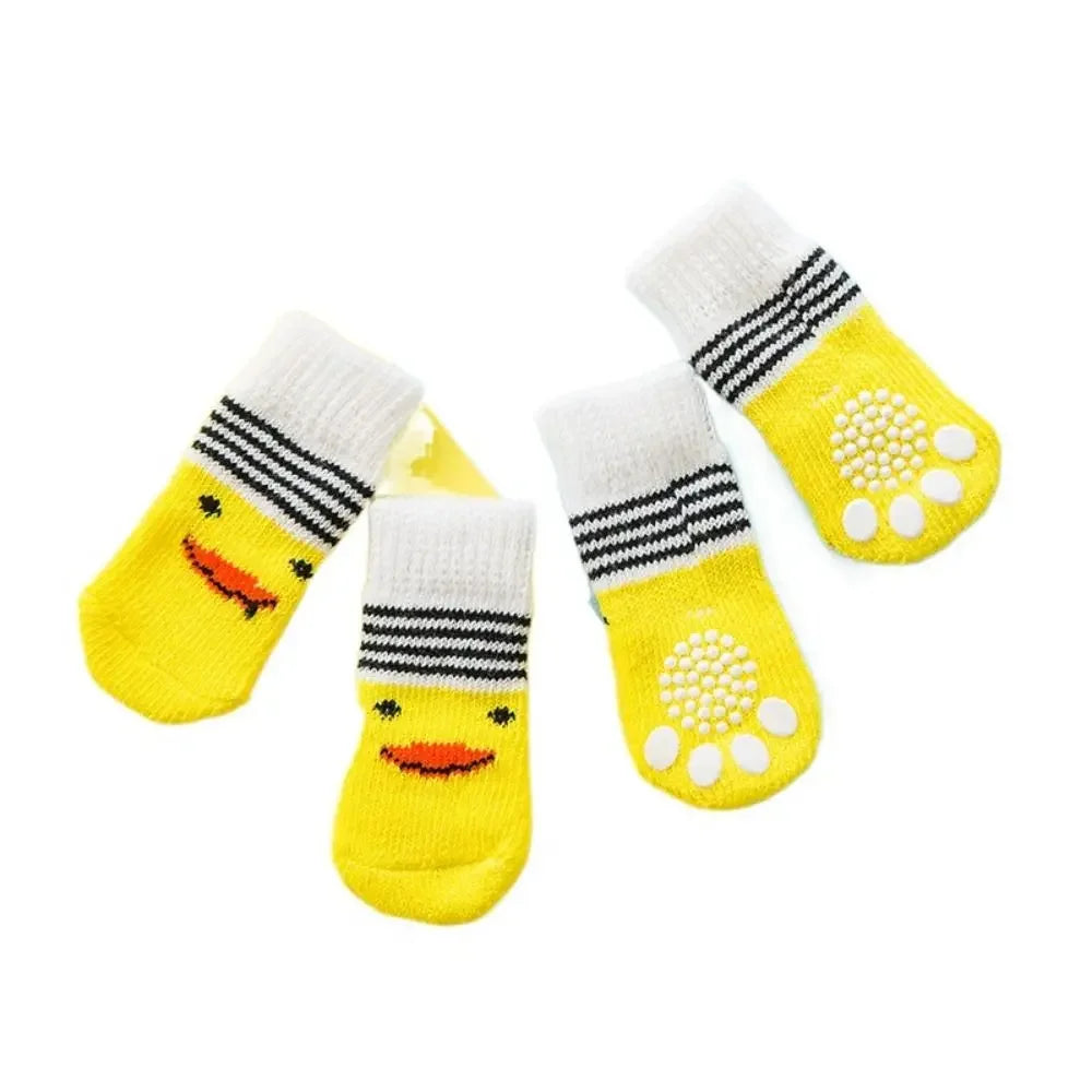Yellow duck-faced pet socks with non-slip grips for indoor traction and paw protection.