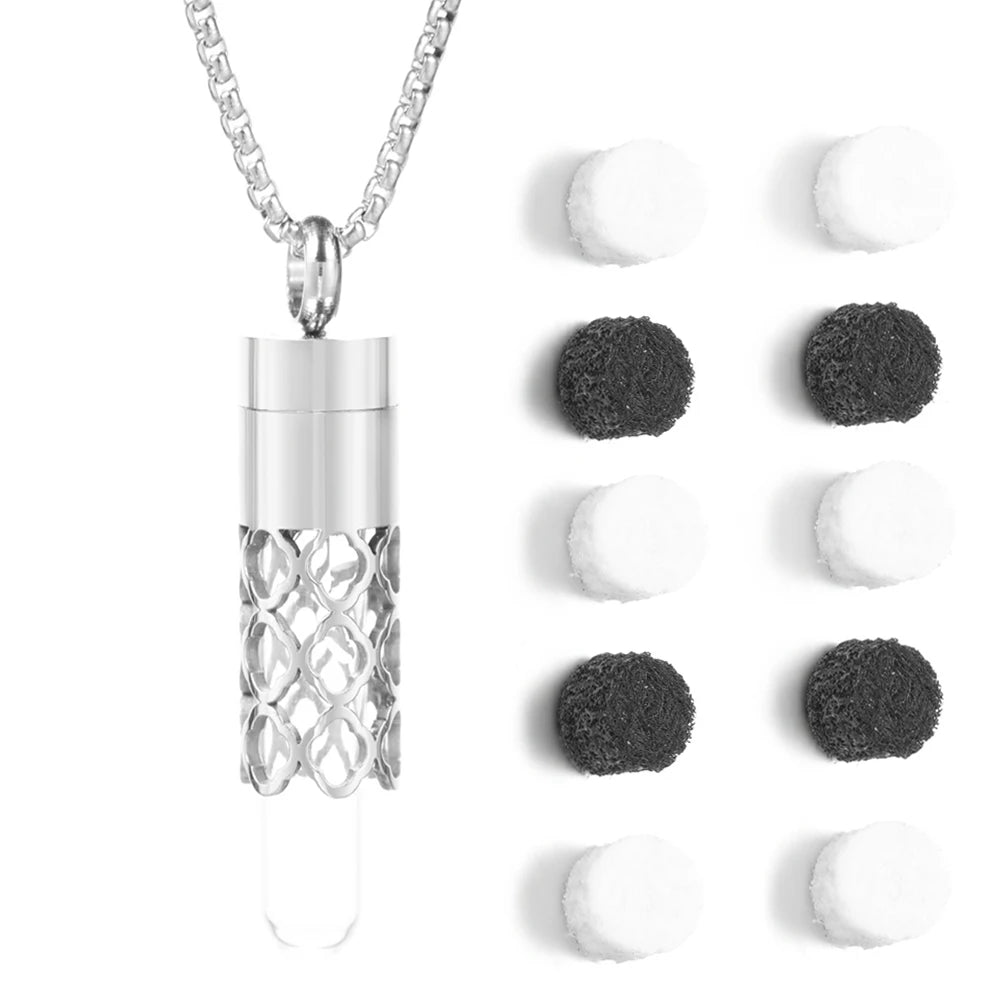 Silver stainless steel diffuser necklace with cage design, oil storage bottle, and felt pads for aromatherapy.