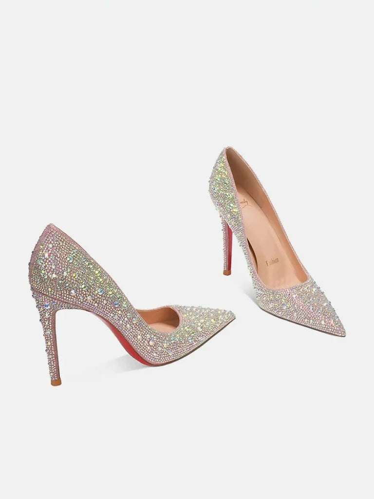 Silver glitter pointed-toe high heels with red soles, cushioned for evening party wear.