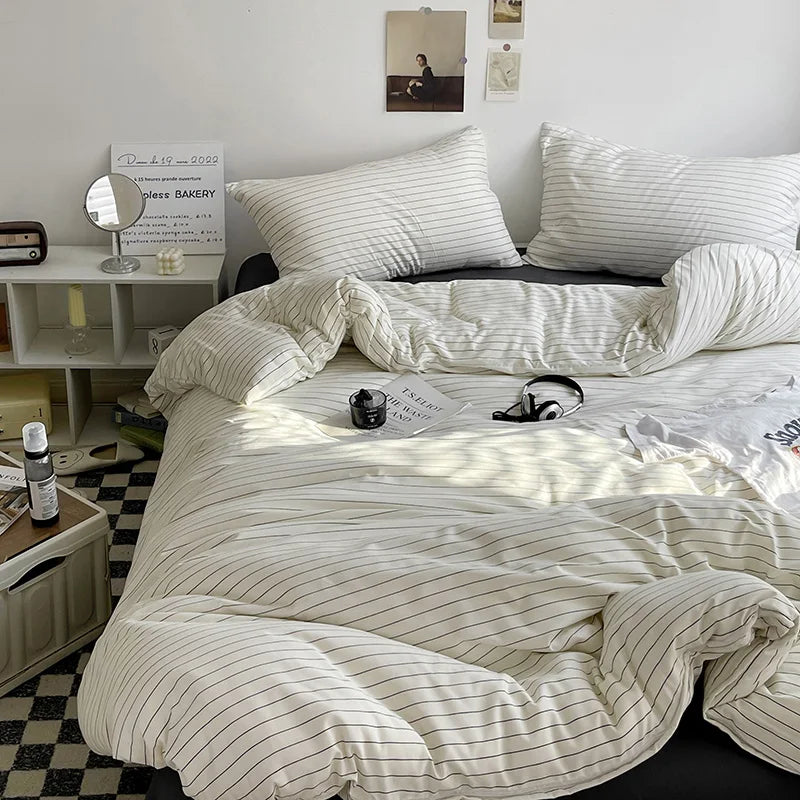 White and grey pinstriped brushed cotton bedding and bath set, providing a cozy feel for a comfortable bedroom.