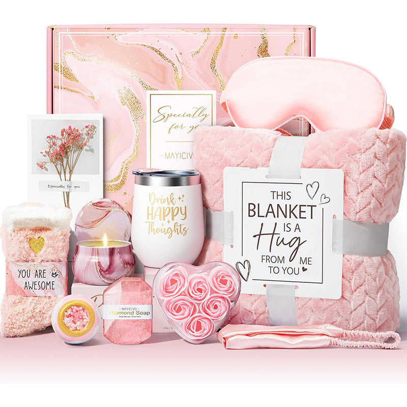 Pink gift set includes hydrating soap, aromatherapy candles, and soft items for a relaxing birthday self-care routine.