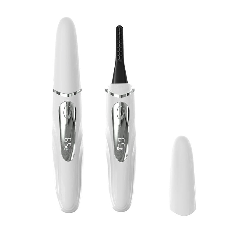 White heated eyelash curler with temperature display, cap beside the device