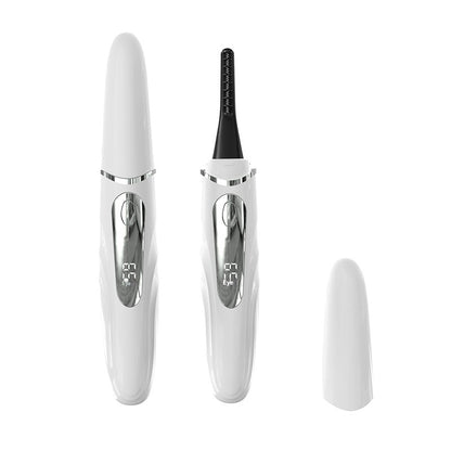 White heated eyelash curler with temperature display, cap beside the device