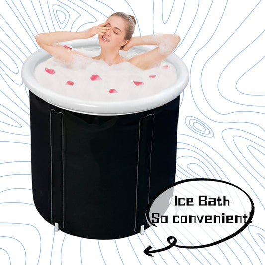 Round black portable bathtub filled with soapy water and rose petals, with a person relaxing inside