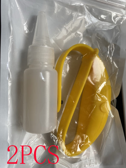 Yellow silicone wristband and refill bottle in a clear plastic bag.