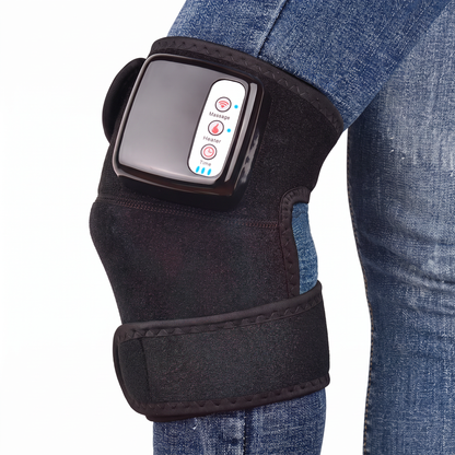 Black fabric knee massager with a glossy control panel worn over blue jeans.