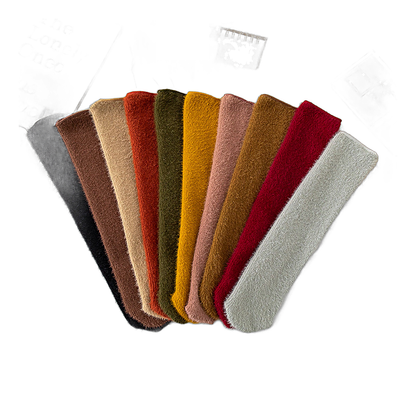 Women's thermal fleece socks in an assortment of vibrant and neutral colors laid out in a fan shape.