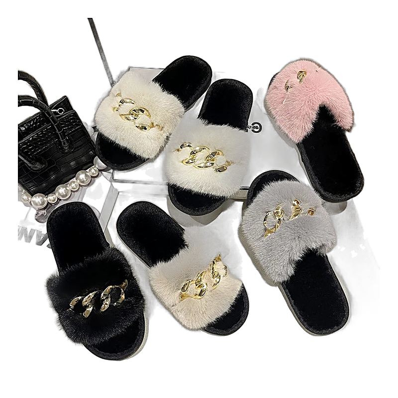 Mule slippers featuring plush faux fur straps and metal chain hardware