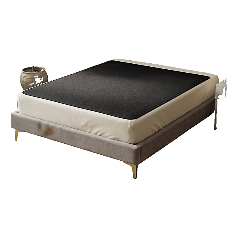 Grounding earthing bed mat laid across a mattress in a styled bedroom