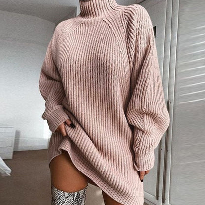 Blush pink ribbed knit sweater dress with a turtleneck for a cozy relaxed fit.