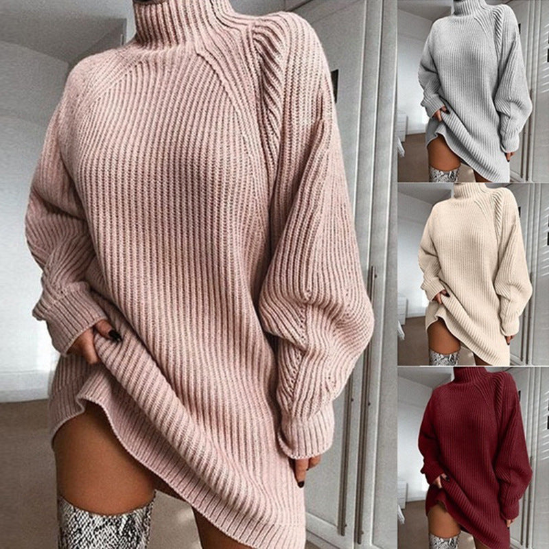 Pink, grey, beige, and red ribbed knit sweater dress with turtleneck, long sleeves, and a relaxed fit for cozy wear.