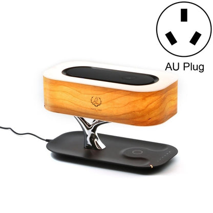 Wood-grain lamp with a metallic tree-shaped base and wireless charging pad, showing AU plug indicator.