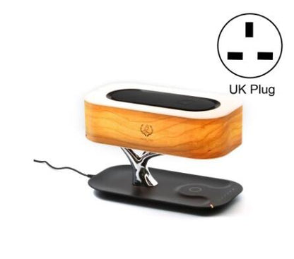 Wooden tree table lamp with silver branch base, black charging pad, and UK plug icon insert