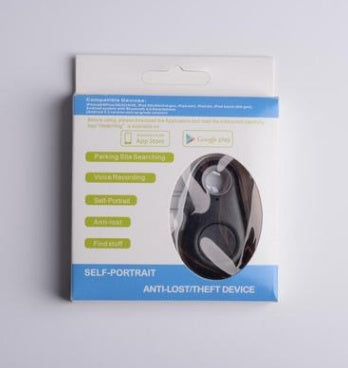 Black oval waterproof bluetooth tracker in retail packaging to help locate keys and bags.