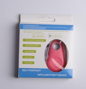 Pink teardrop-shaped Bluetooth tracker in retail packaging for locating keys and bags.