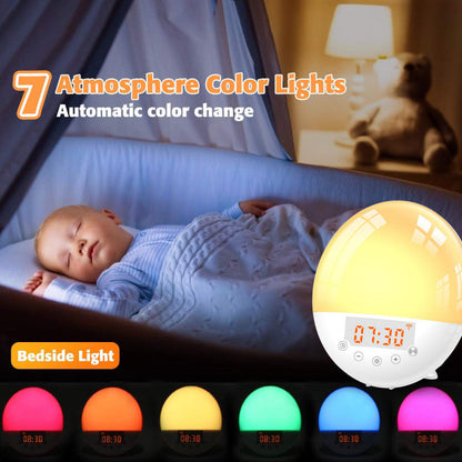 Round alarm clock glowing with a warm yellow light next to a sleeping baby in a crib.
