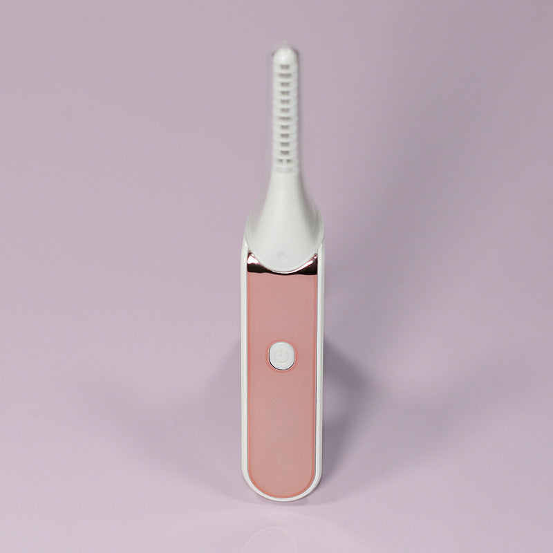 Heated eyelash curler front view with power button