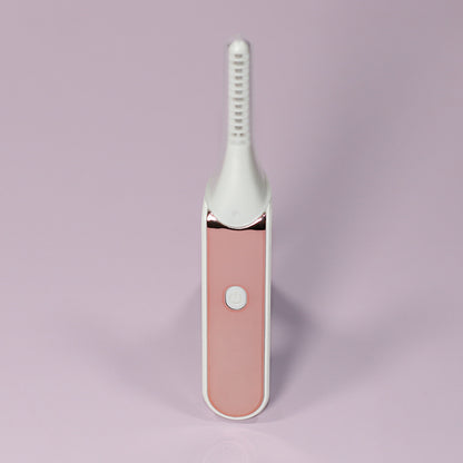 Heated eyelash curler front view with power button