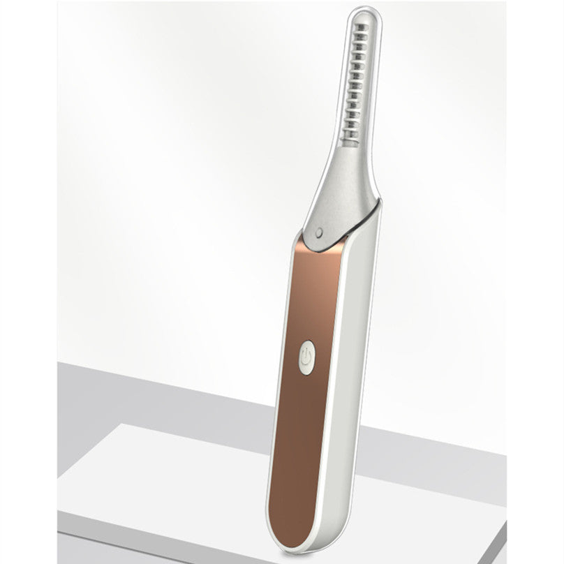 Electric heated eyelash curler with white and rose gold finish and power button