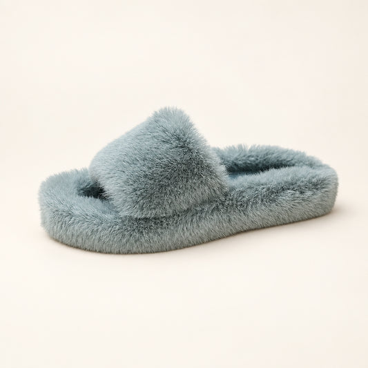 Women's plush warm indoor house slipper in blue-grey, featuring a soft fuzzy upper and thick cushioned sole in a side view.