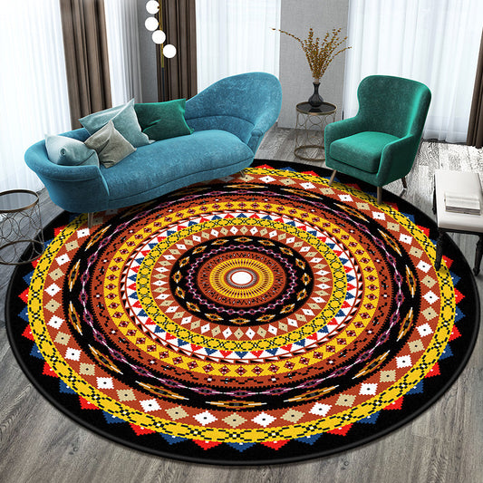 Round area rug with colorful geometric mandala pattern in a living room.