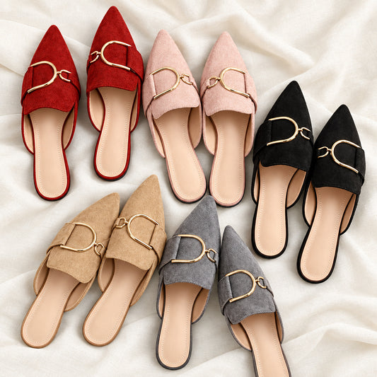 five pairs of pointed-toe slip-on mules in various colors with gold-tone metal buckle details on a light fabric