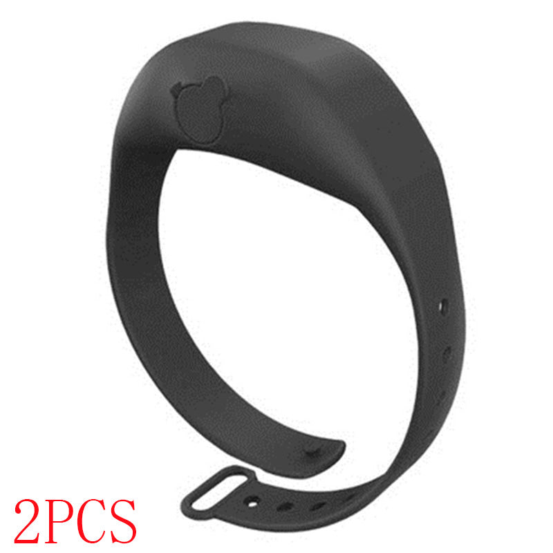 Black silicone hand sanitizer dispenser bracelet with adjustable strap and bear emblem.