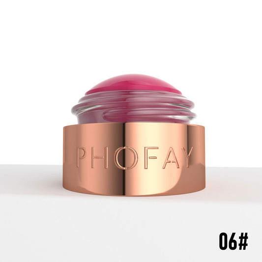Open blush cream jar with a shiny rose gold base and a domed pink tint visible.