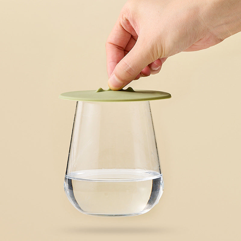 Luxe Home Merch silicone suction cup lid sealing a glass cup of water tightly