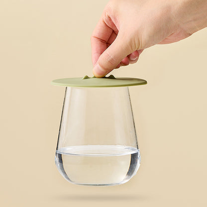 Luxe Home Merch silicone suction cup lid sealing a glass cup of water tightly