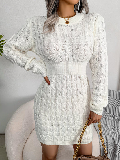 White cable knit sweater dress with a sculpting waist, suitable for winter outings.