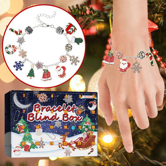 Christmas charm bracelet with Santa and snowflake charms, shown with advent calendar box.