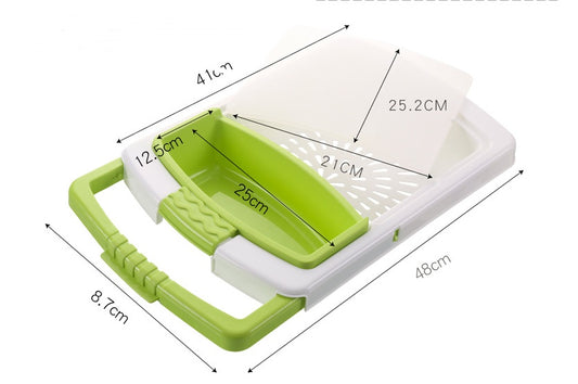 Over sink cutting board with green colander and dimensions overlay