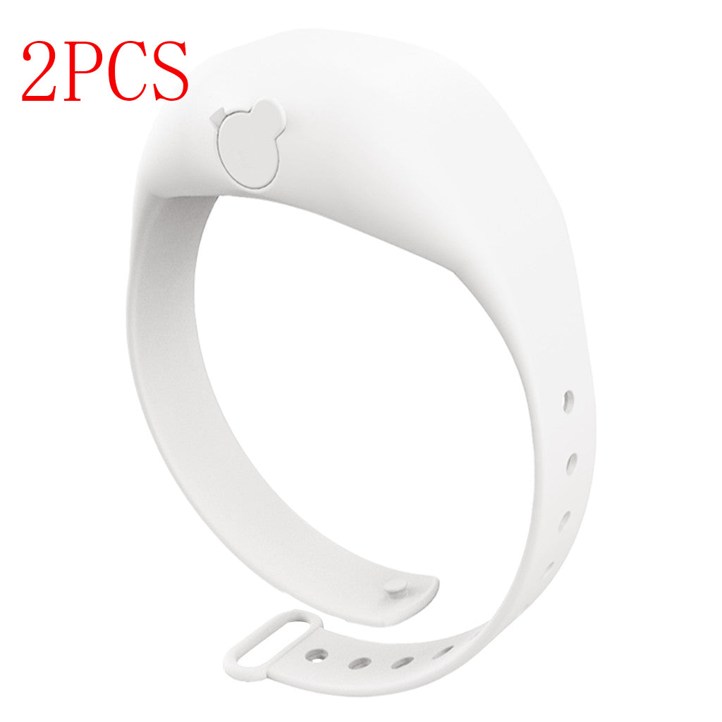White silicone dispenser bracelet with adjustable strap and bear-shaped fill cap.