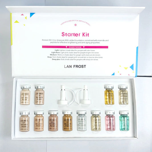 Brightening serum ampoule set with multiple glass vials and droppers in an open starter kit box