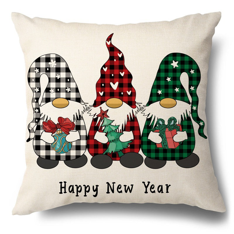 Square pillow cover featuring three gnomes in buffalo plaid hats holding holiday items above Happy New Year text.