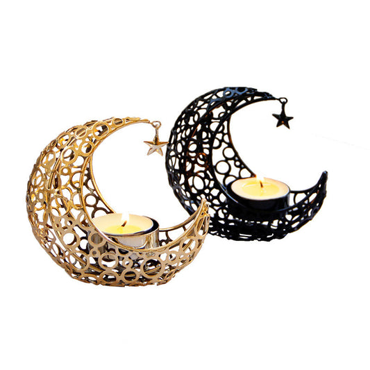 Gold and black metal crescent moon candle holders with intricate circle patterns and hanging star charms.