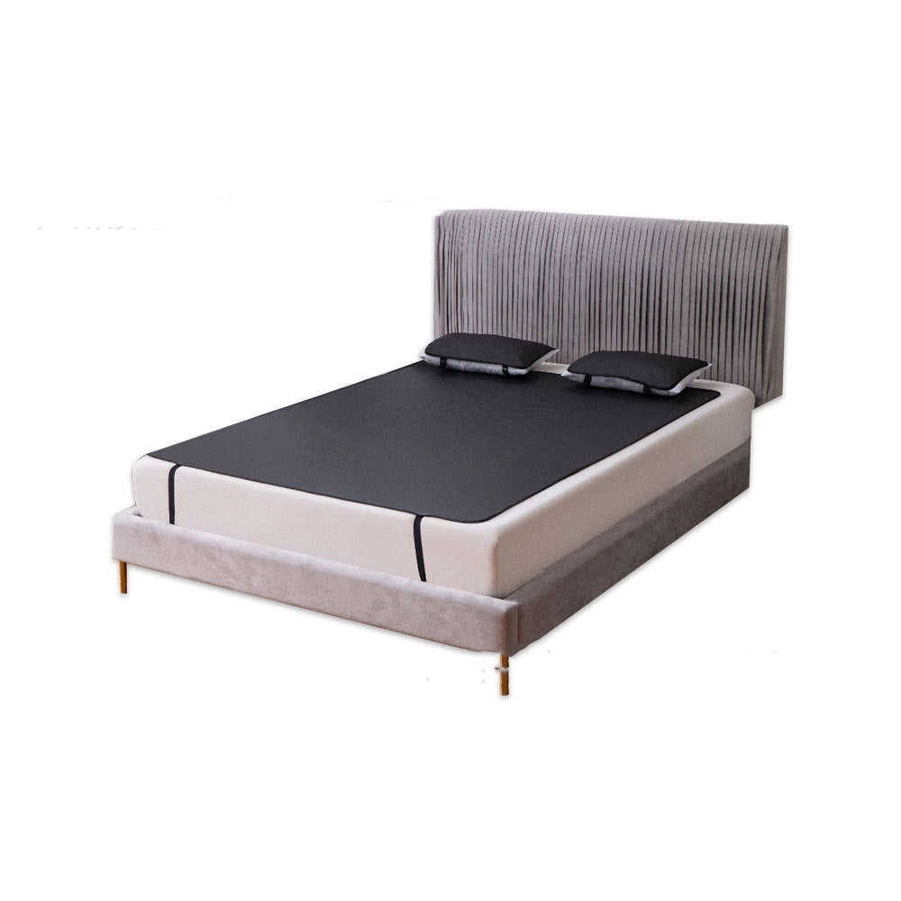 Grounding earthing bed mat on a mattress shown from an angled view