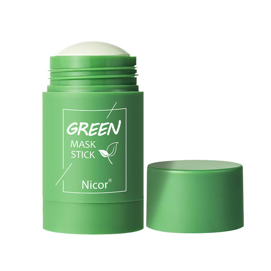 Green mask stick with exposed light-colored clay and a separate matching cap.
