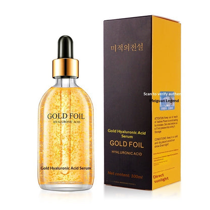 Gold foil hyaluronic acid serum bottle beside its box