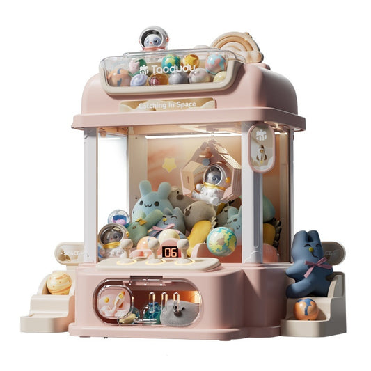 Pink space-themed claw machine toy filled with colorful mini plushies and spherical prizes.