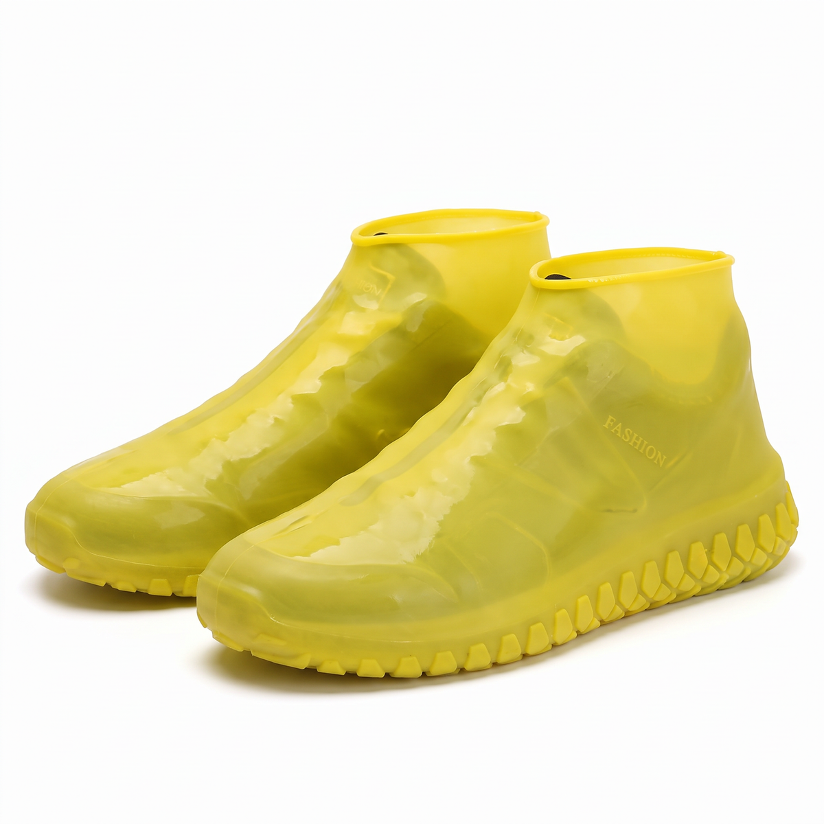 Bright yellow waterproof silicone shoe covers with anti-slip treaded soles.