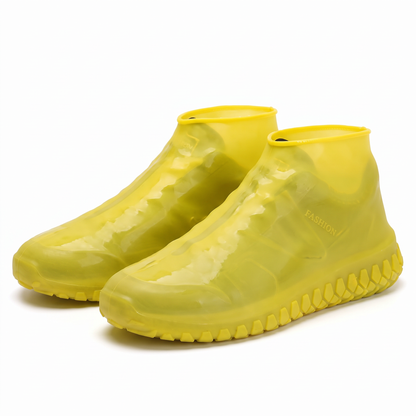 Bright yellow waterproof silicone shoe covers with anti-slip treaded soles.